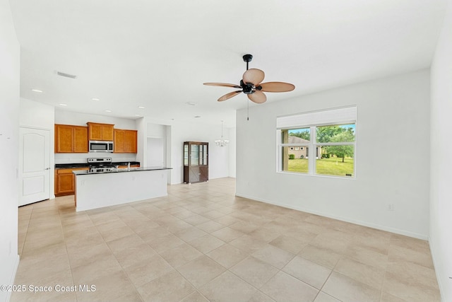 unfurnished living room featuring recessed lighting, light tile patterned floors, visible vents, and ceiling fan with notable chandelier