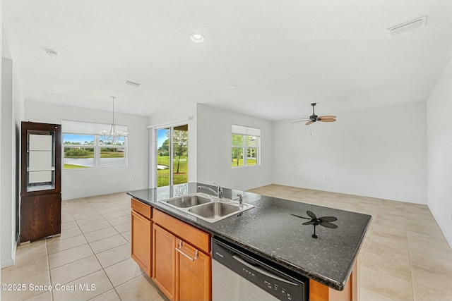 kitchen featuring ceiling fan with notable chandelier, stainless steel dishwasher, visible vents, light tile patterned flooring, and a sink