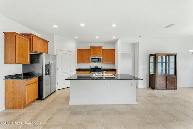 kitchen with brown cabinets, recessed lighting, a sink, and stainless steel appliances