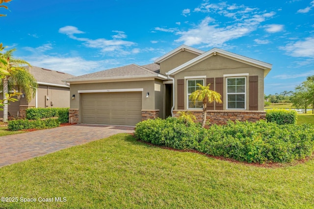 ranch-style home featuring a garage, a front yard, driveway, and stucco siding