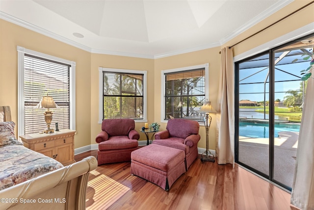 bedroom with light wood-type flooring, access to outside, and baseboards
