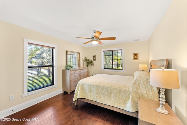 bedroom featuring ceiling fan, baseboards, dark wood finished floors, and visible vents