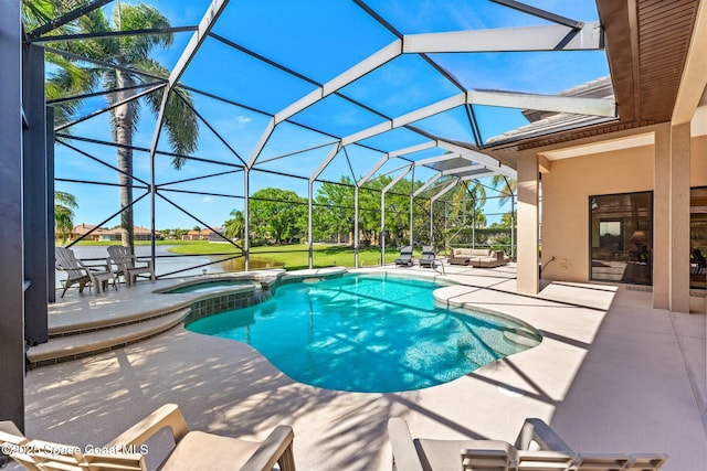 view of pool featuring a patio area, a pool with connected hot tub, and a lanai