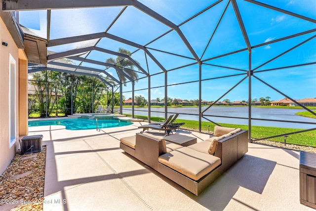 view of pool with a patio area, an outdoor hangout area, a water view, a pool with connected hot tub, and glass enclosure