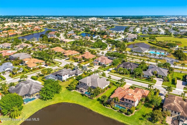 aerial view featuring a water view and a residential view