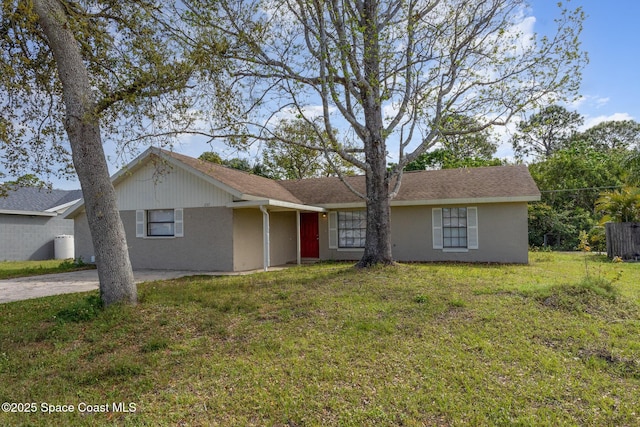 257 Dorado Ave NE, Palm Bay, FL 32907 - ranch-style home with a front yard and stucco siding