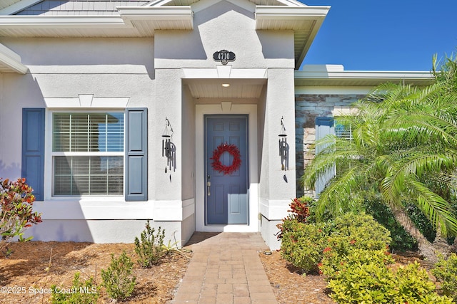 4710 Hebron Dr, Merritt Island, FL 32953 - view of exterior entry featuring stucco siding