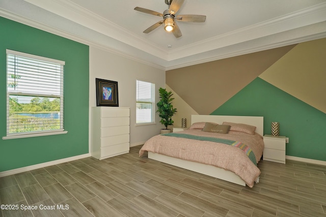4710 Hebron Dr, Merritt Island, FL 32953 - bedroom featuring a ceiling fan, baseboards, wood tiled floor, and ornamental molding