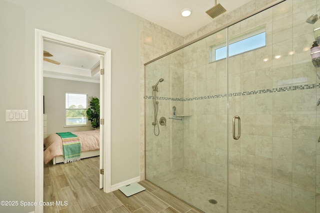 4710 Hebron Dr, Merritt Island, FL 32953 - full bathroom with ensuite bathroom, baseboards, crown molding, wood finish floors, and a stall shower