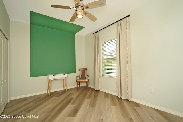 4710 Hebron Dr, Merritt Island, FL 32953 - spare room featuring wood finished floors, ceiling fan, and baseboards