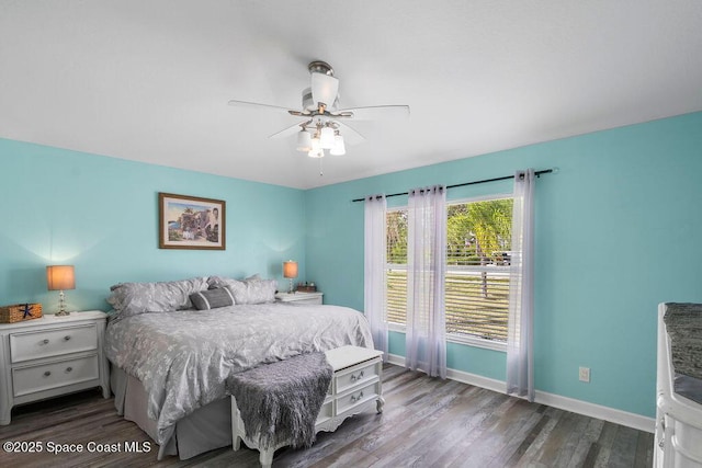 bedroom with wood finished floors, baseboards, and a ceiling fan