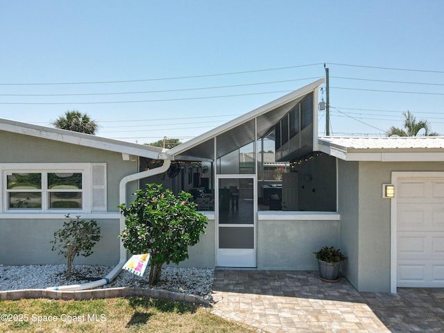 125 Terry St, Indian Harbour Beach, FL 32937 - entrance to property featuring stucco siding and a garage