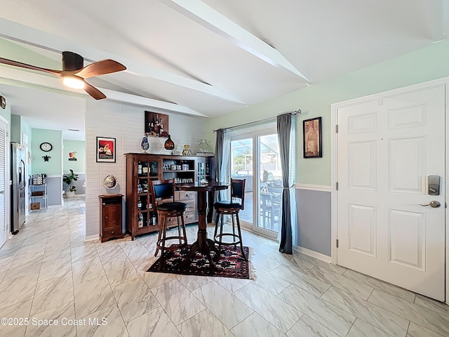 125 Terry St, Indian Harbour Beach, FL 32937 - dining area with marble finish floor, vaulted ceiling with beams, baseboards, and a ceiling fan