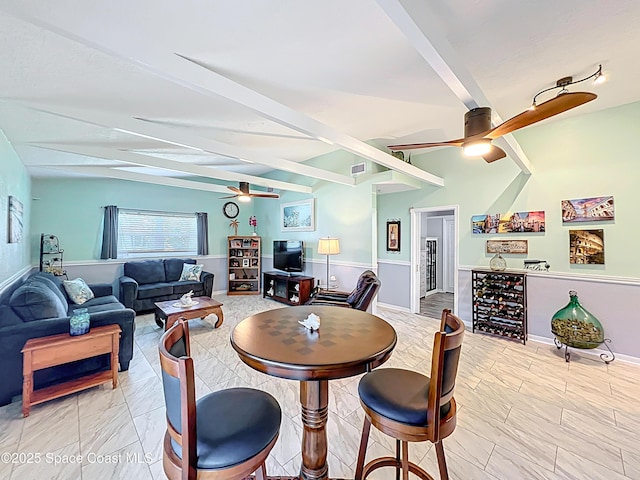 125 Terry St, Indian Harbour Beach, FL 32937 - dining space with beverage cooler, a wainscoted wall, visible vents, beamed ceiling, and ceiling fan