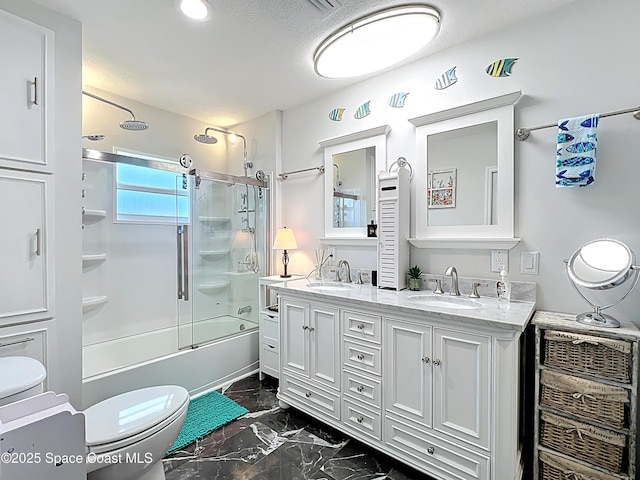125 Terry St, Indian Harbour Beach, FL 32937 - full bathroom with shower / bath combination with glass door, marble finish floor, toilet, and a sink