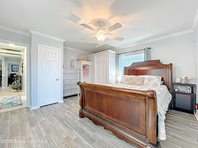 125 Terry St, Indian Harbour Beach, FL 32937 - bedroom featuring baseboards, visible vents, ceiling fan, wood finish floors, and ornamental molding