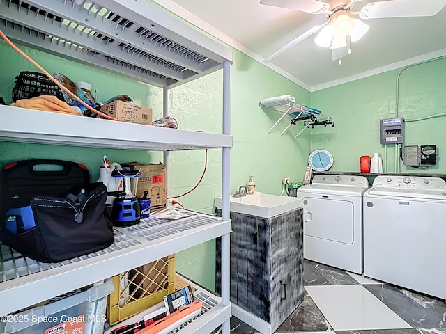 125 Terry St, Indian Harbour Beach, FL 32937 - laundry room with washing machine and clothes dryer, a sink, marble finish floor, ceiling fan, and crown molding