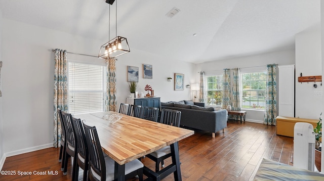 1546 Litchfield Dr, Melbourne, FL 32904 - dining room with visible vents, baseboards, a chandelier, vaulted ceiling, and wood finished floors