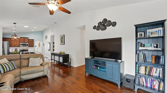 1546 Litchfield Dr, Melbourne, FL 32904 - living area with dark wood finished floors, ceiling fan, visible vents, and lofted ceiling