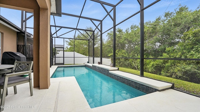 1546 Litchfield Dr, Melbourne, FL 32904 - pool featuring fence, glass enclosure, a patio, and area for grilling