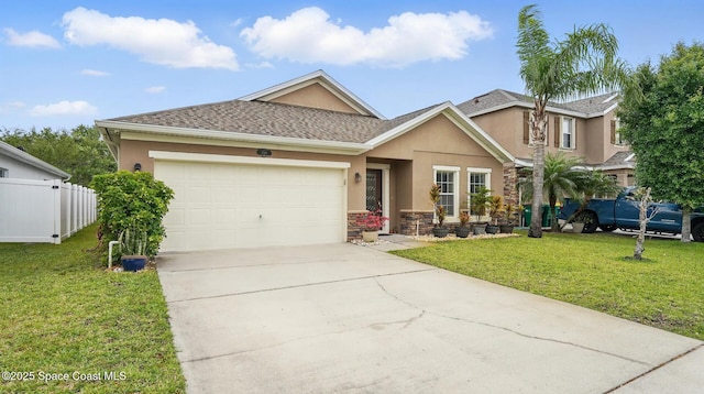 1546 Litchfield Dr, Melbourne, FL 32904 - view of front of house featuring an attached garage, concrete driveway, stucco siding, and a front lawn