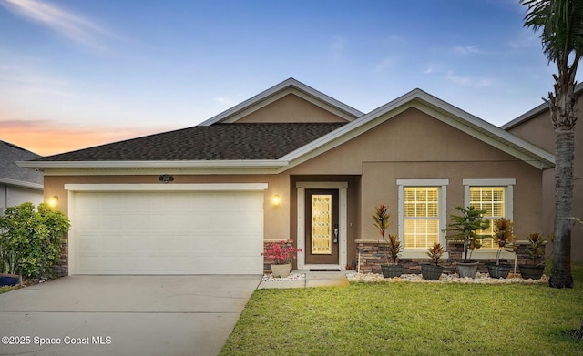 1546 Litchfield Dr, Melbourne, FL 32904 - ranch-style house with stucco siding, roof with shingles, a front yard, an attached garage, and driveway