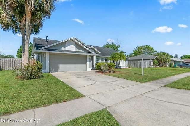 single story home with stucco siding, driveway, an attached garage, a front yard, and fence