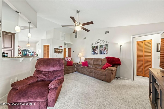 living area with visible vents, ceiling fan, light carpet, and lofted ceiling