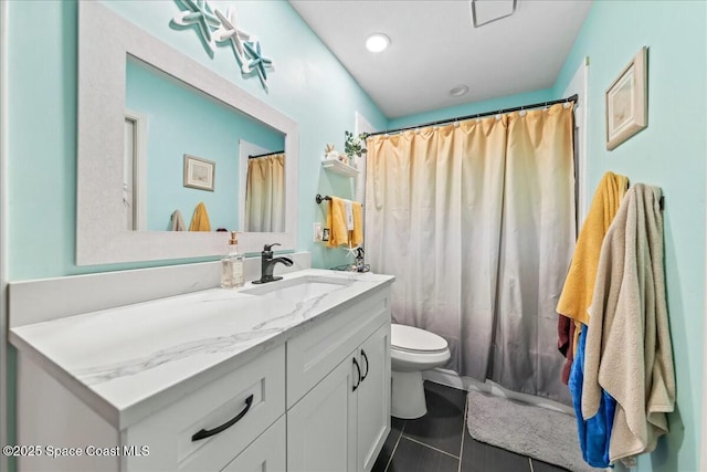 bathroom featuring tile patterned floors, toilet, vanity, and a shower with curtain