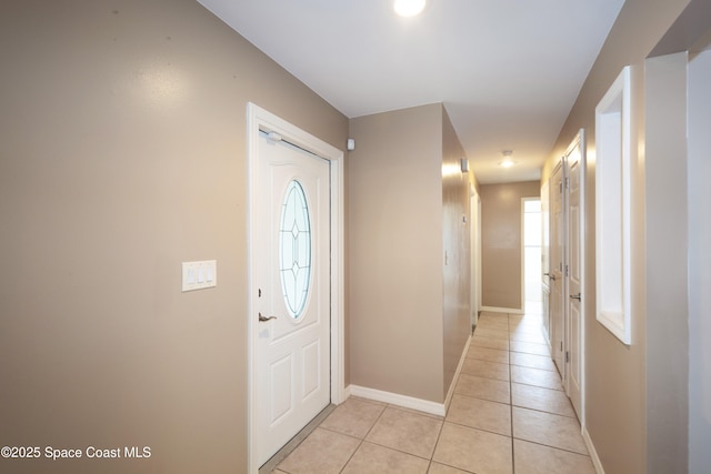 881 Brookson Ave NW, Palm Bay, FL 32907 - entryway featuring baseboards and light tile patterned floors