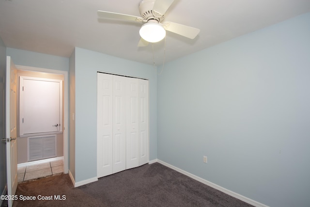 881 Brookson Ave NW, Palm Bay, FL 32907 - unfurnished bedroom featuring a ceiling fan, a closet, carpet, baseboards, and visible vents