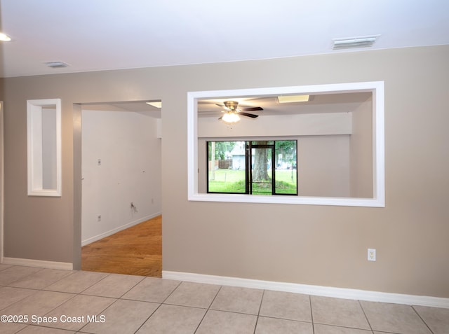 881 Brookson Ave NW, Palm Bay, FL 32907 - spare room with tile patterned floors, a ceiling fan, and visible vents