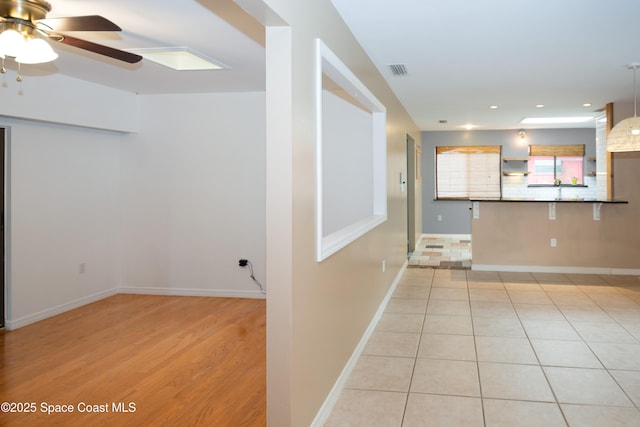 881 Brookson Ave NW, Palm Bay, FL 32907 - interior space featuring recessed lighting, visible vents, light tile patterned floors, baseboards, and ceiling fan