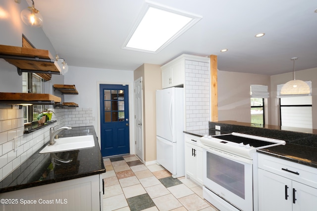 881 Brookson Ave NW, Palm Bay, FL 32907 - kitchen with open shelves, white appliances, a sink, and backsplash