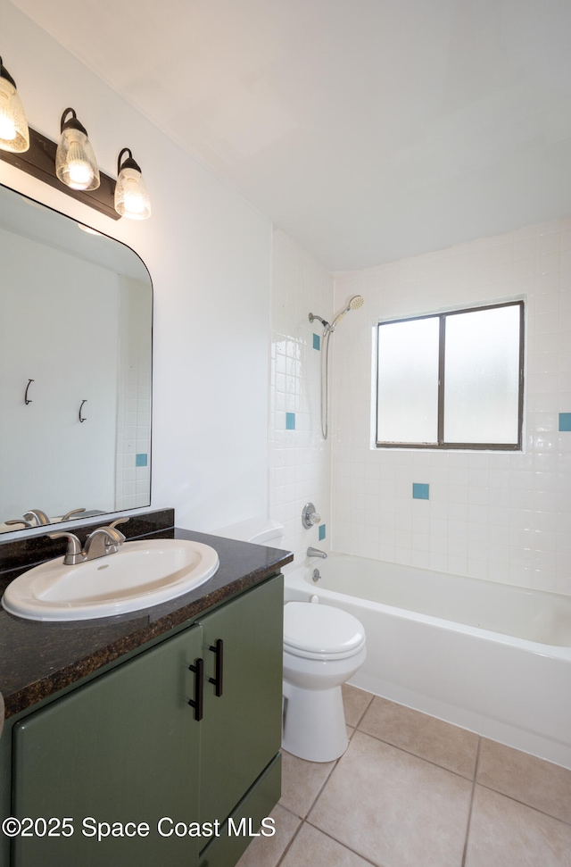 881 Brookson Ave NW, Palm Bay, FL 32907 - bathroom featuring toilet, bathtub / shower combination, vanity, and tile patterned floors