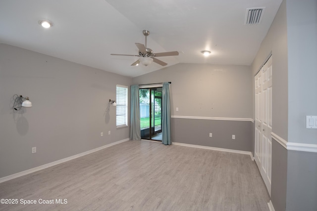 881 Brookson Ave NW, Palm Bay, FL 32907 - empty room featuring vaulted ceiling, ceiling fan, light wood-style flooring, baseboards, and visible vents