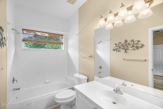full bathroom featuring bathing tub / shower combination, vanity, visible vents, and toilet