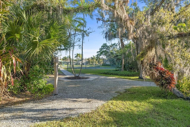 surrounding community with fence and a gate