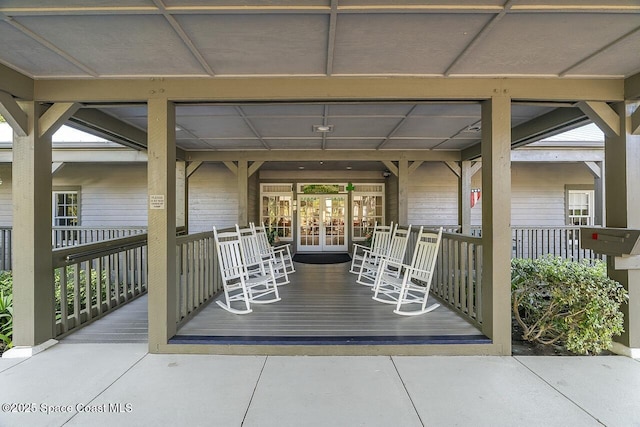 doorway to property featuring french doors and covered porch