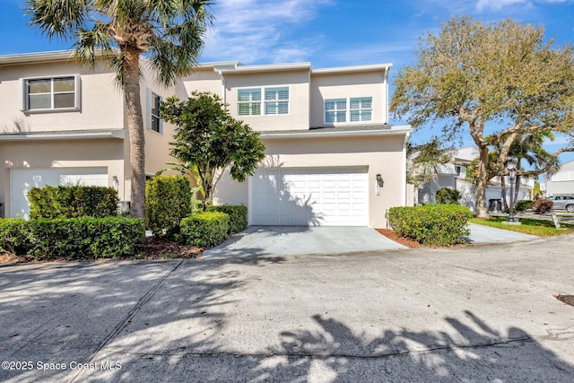 2470 Harbour Cove Dr, Hutchinson Island, FL 34949 - multi unit property featuring a garage, stucco siding, and driveway