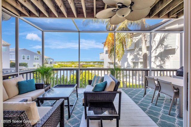 2470 Harbour Cove Dr, Hutchinson Island, FL 34949 - sunroom with an outdoor hangout area, a ceiling fan, and a water view