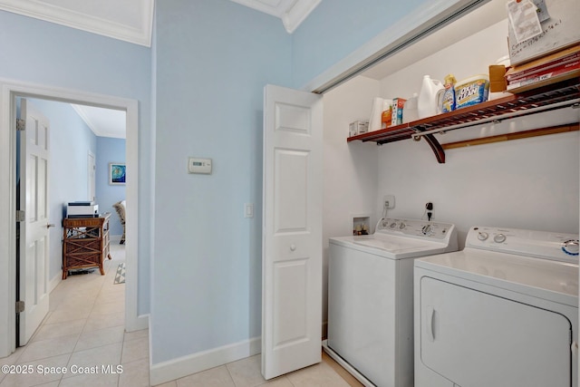 2470 Harbour Cove Dr, Hutchinson Island, FL 34949 - laundry room featuring laundry area, independent washer and dryer, ornamental molding, light tile patterned flooring, and baseboards