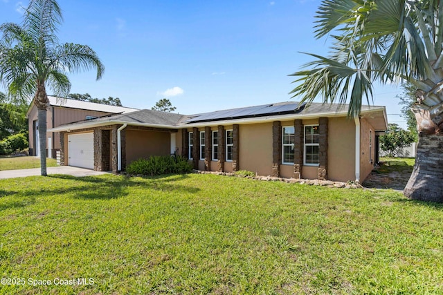 ranch-style house featuring stucco siding, driveway, an attached garage, a front yard, and roof mounted solar panels