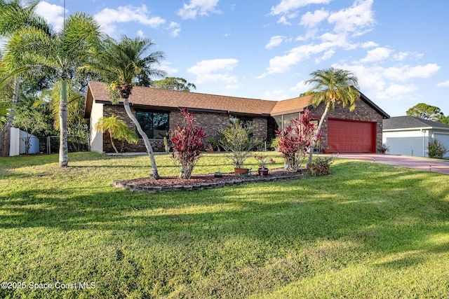 single story home with an attached garage, concrete driveway, brick siding, and a front yard