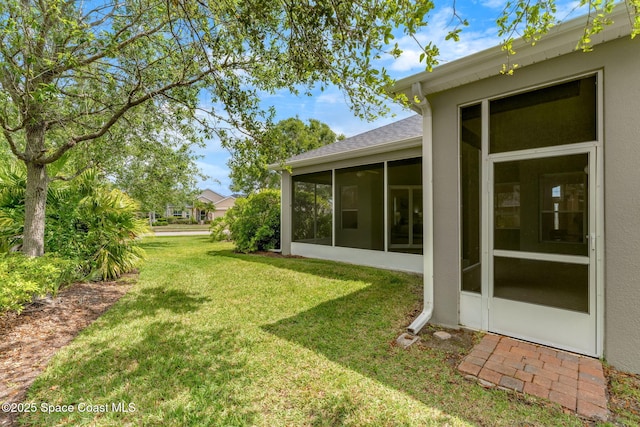 view of yard featuring a sunroom