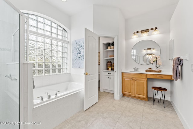 bathroom with a bath, an enclosed shower, tile patterned floors, and vanity