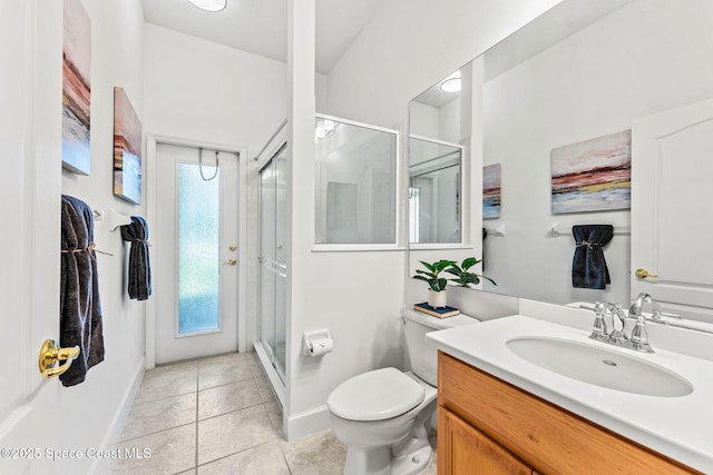 full bath with a shower stall, vanity, baseboards, toilet, and tile patterned flooring
