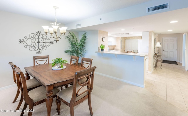 8941 Lake Dr Unit 204, Cape Canaveral, FL 32920 - dining space with baseboards, a notable chandelier, and visible vents