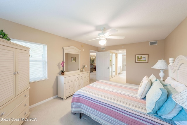 8941 Lake Dr Unit 204, Cape Canaveral, FL 32920 - bedroom featuring ceiling fan, light colored carpet, baseboards, and visible vents