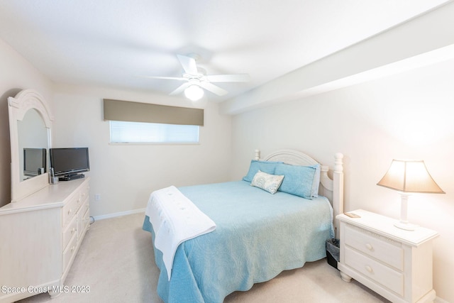 8941 Lake Dr Unit 204, Cape Canaveral, FL 32920 - bedroom featuring light carpet, ceiling fan, and baseboards